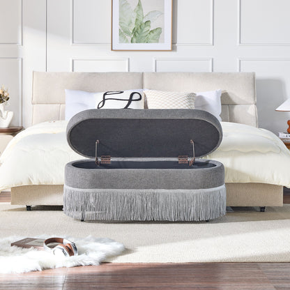 Oval Upholstered Storage Ottoman With Fringe Trim &amp; Lift Top Lid
