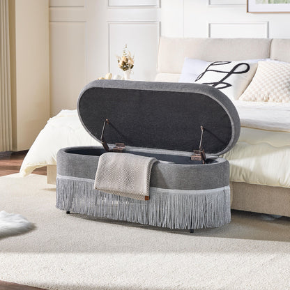 Oval Upholstered Storage Ottoman With Fringe Trim &amp; Lift Top Lid